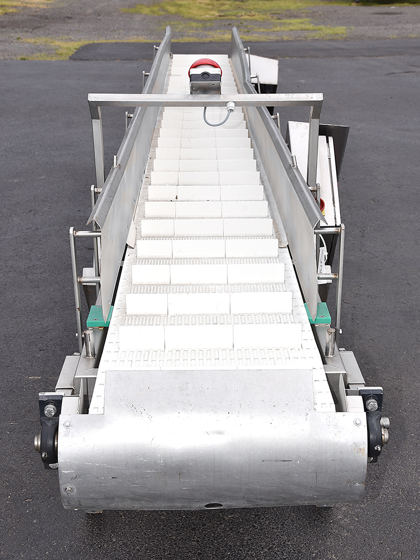 Used INCLINE FEED BELT, 18 inch wide by 18.5 foot long, cleated, stainless steel body; Alard item Y3625