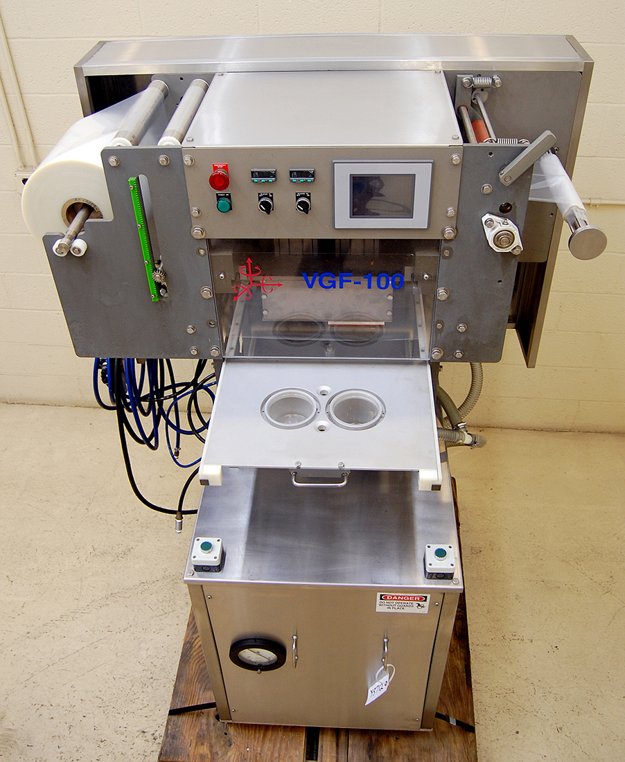 Used Tray and cup sealing machine, vacuum, gas flush; Alard food packaging equipment item Y3712